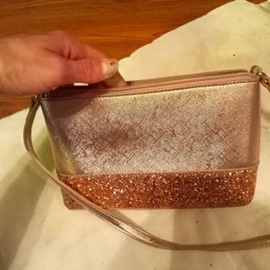 Elegant sleek and very in style gold sparkly Kate Spade handbag